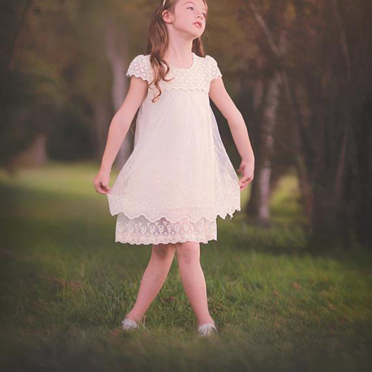 Ladies lace dress with floral design and flared hem Lune London