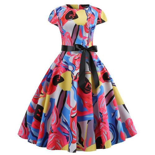 Robe évasée pour femmes avec un design floral vibrant et une ceinture élégante.