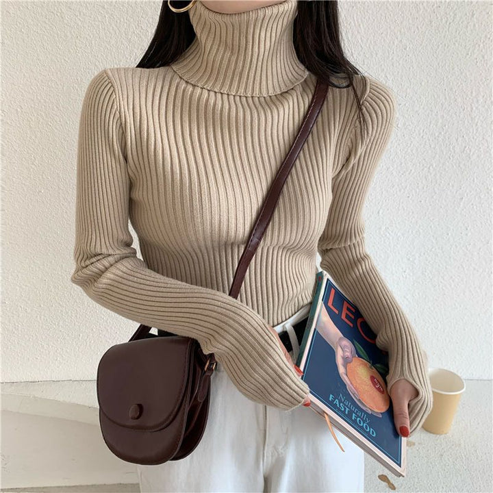 Figure-hugging turtleneck sweater with thumbholes
