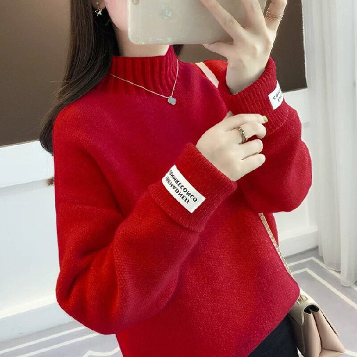 Pull féminin à la mode avec col haut et design texturé Chic & Stil