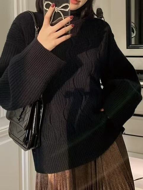 Padded knit sweater with roll neck
