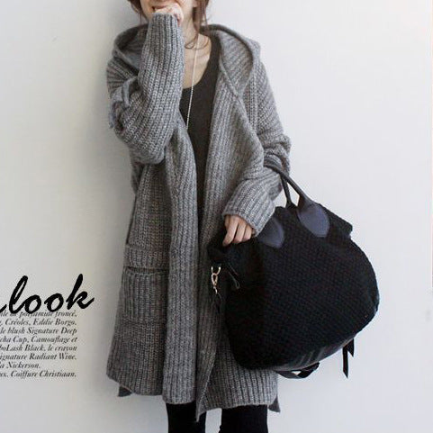 Ladies thick knitted coat with practical pockets and fashionable belt Amarae