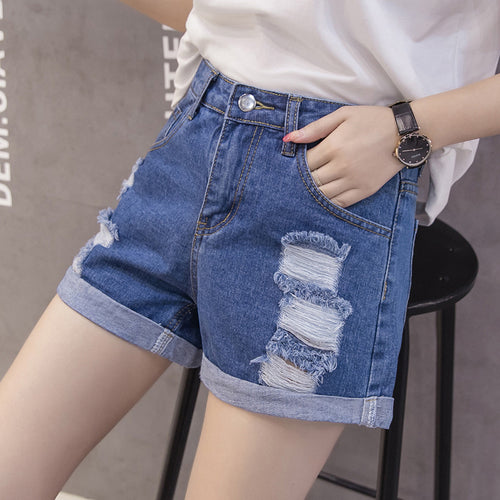 Women's denim shorts with trendy distressed design and casual cuff