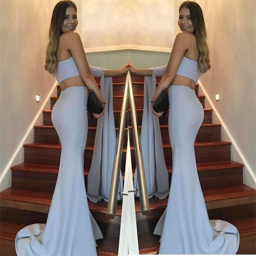 Women's elegant off-the-shoulder evening dress with asymmetric cut and flowing fabric
