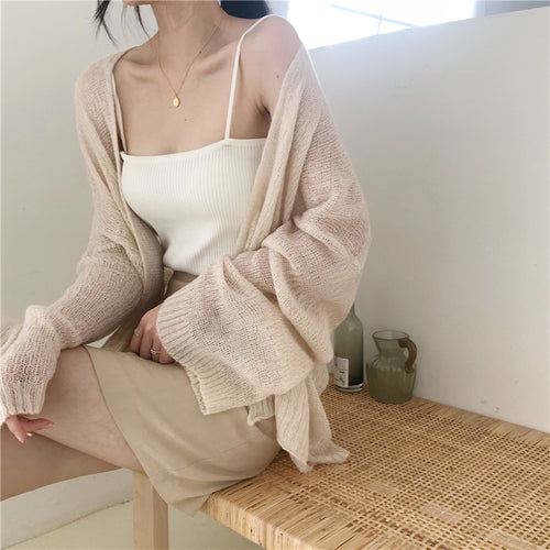 Casual knitted cardigan for women with a loose fit and open sleeves Amarael