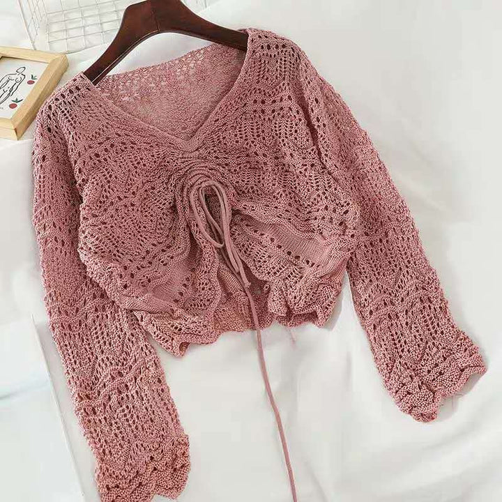 Knit sweater for women with a decorative hole pattern and an adjustable drawstring Lune London