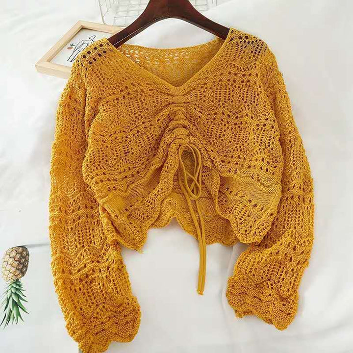 Knit sweater for women with a decorative hole pattern and an adjustable drawstring Lune London