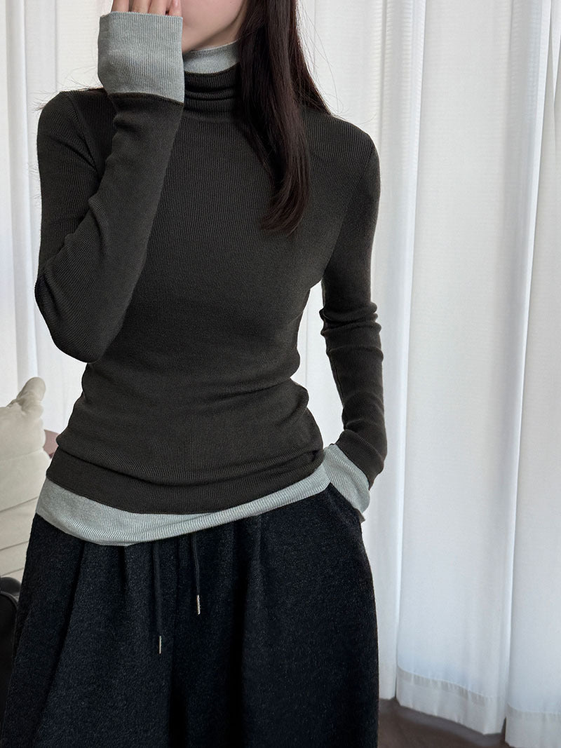 Women's knit pullover with stand-up collar and contrast details