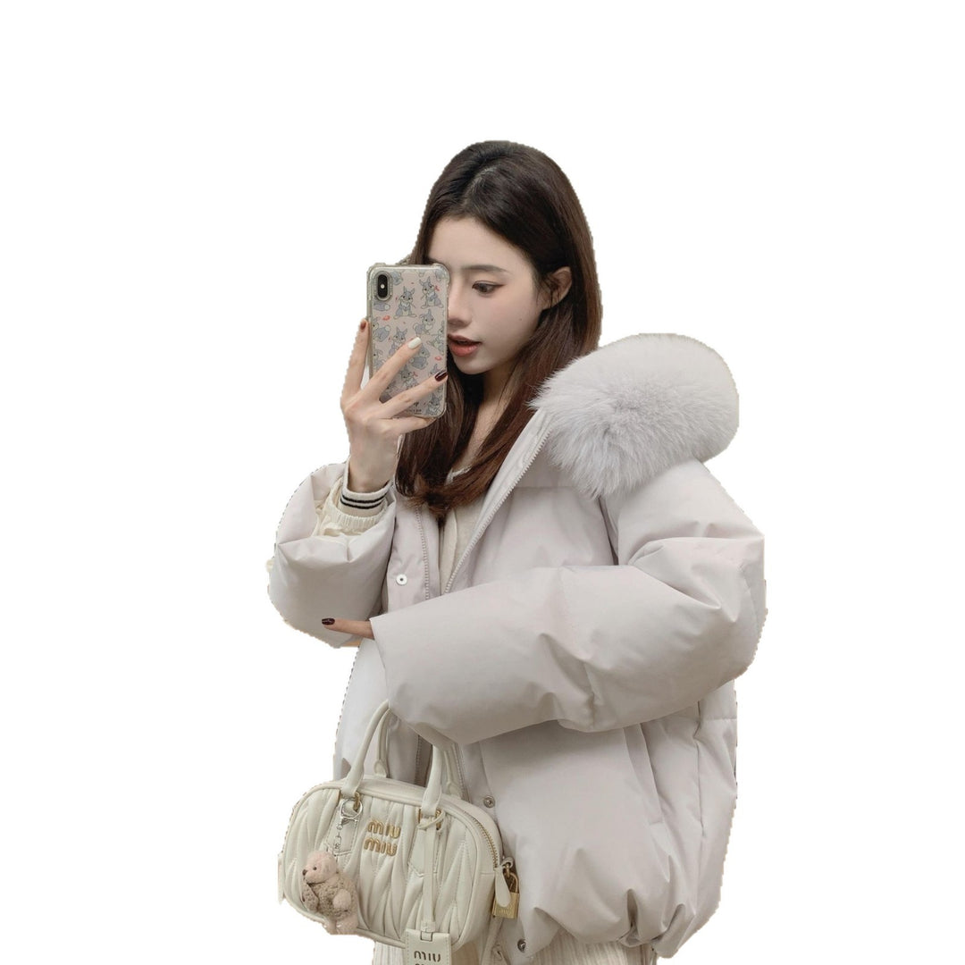 Short, padded women's jacket with hood and fur collar