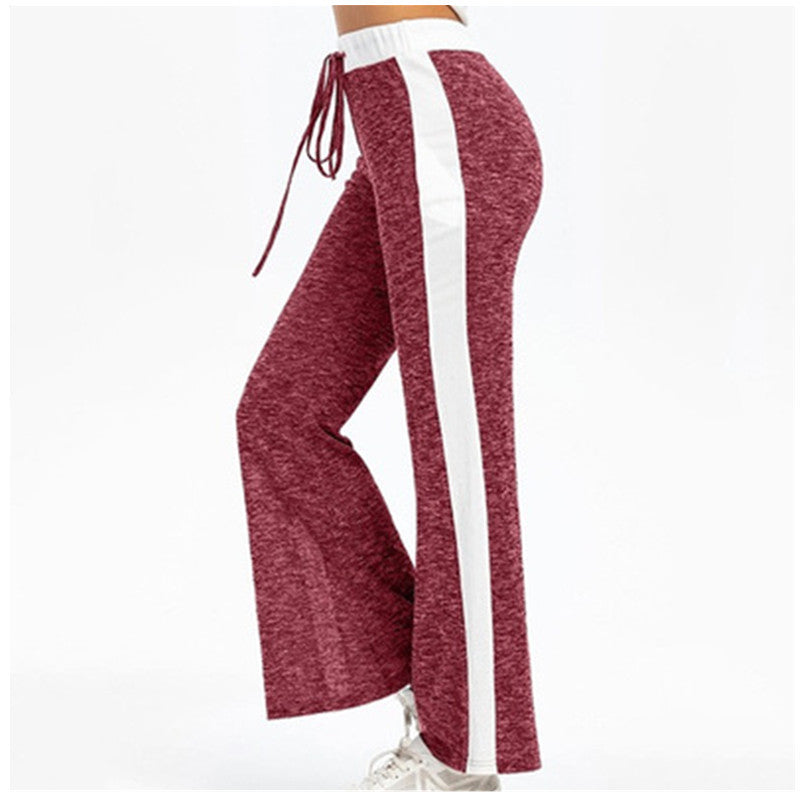 Fluid sports pants for women with side stripes and elastic waist Lune London