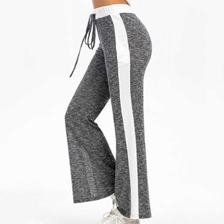 Fluid sports pants for women with side stripes and elastic waist Lune London