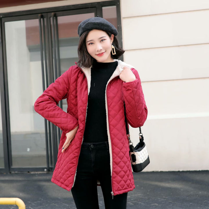 Women's quilted coat with hood and lambskin look