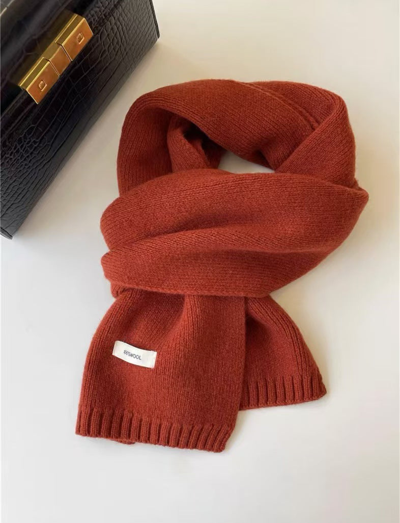 Simple knitted scarf made of pure wool