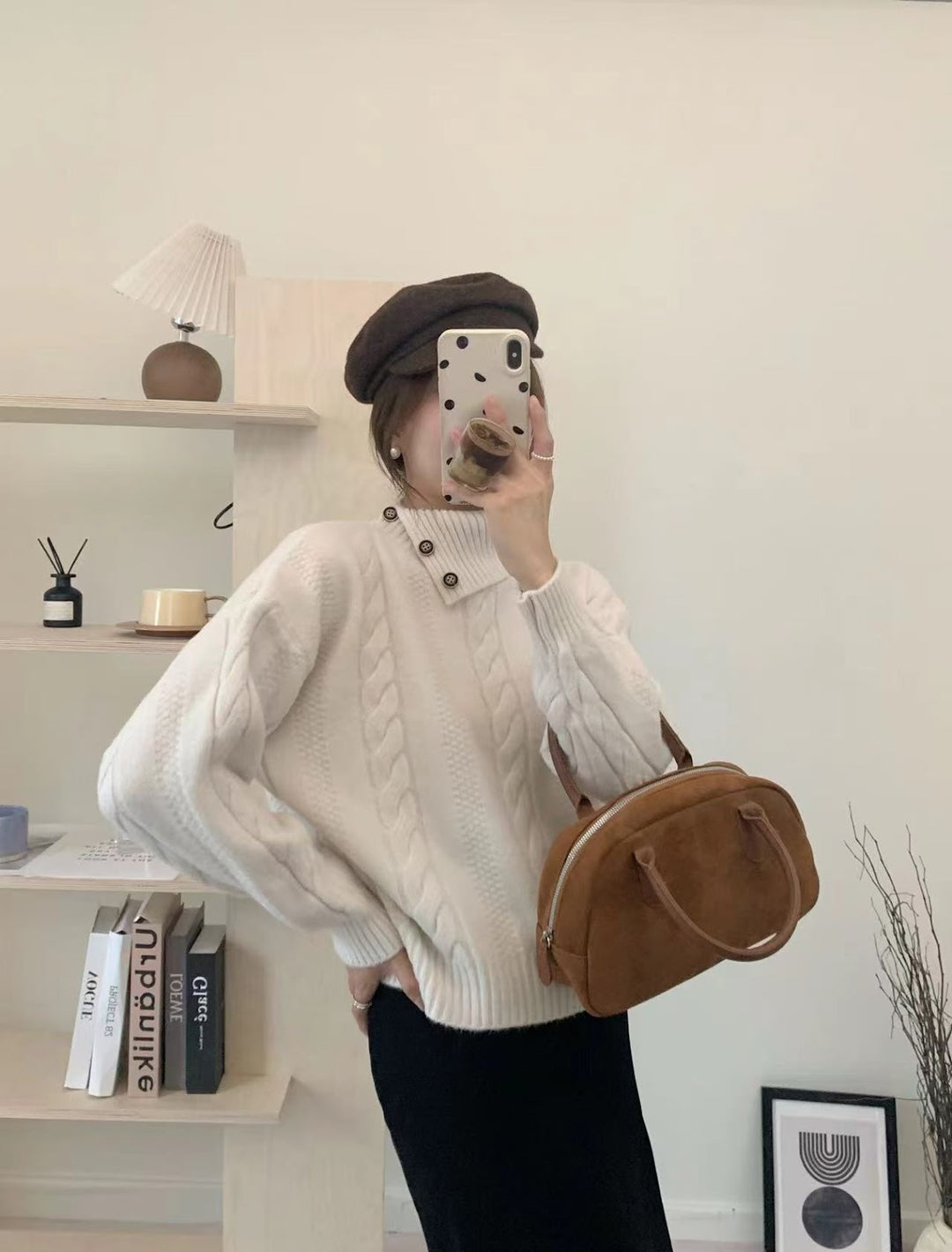 Short cable knit sweater with asymmetric neckline