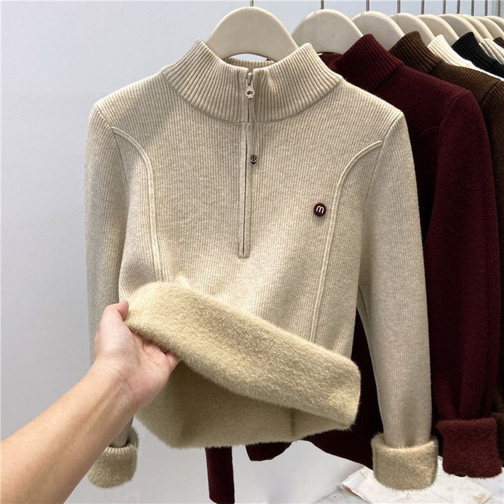 Padded women's knitted sweater with zipper and stand-up collar