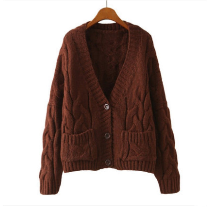 Thick knitted cardigan for women with classic braid pattern and practical pockets Lune London