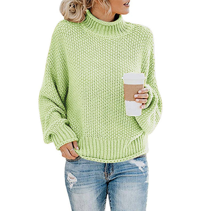 Highly flammable knitted sweater for women in a relaxed boxy shape with a roll neck and textured structure Lune London
