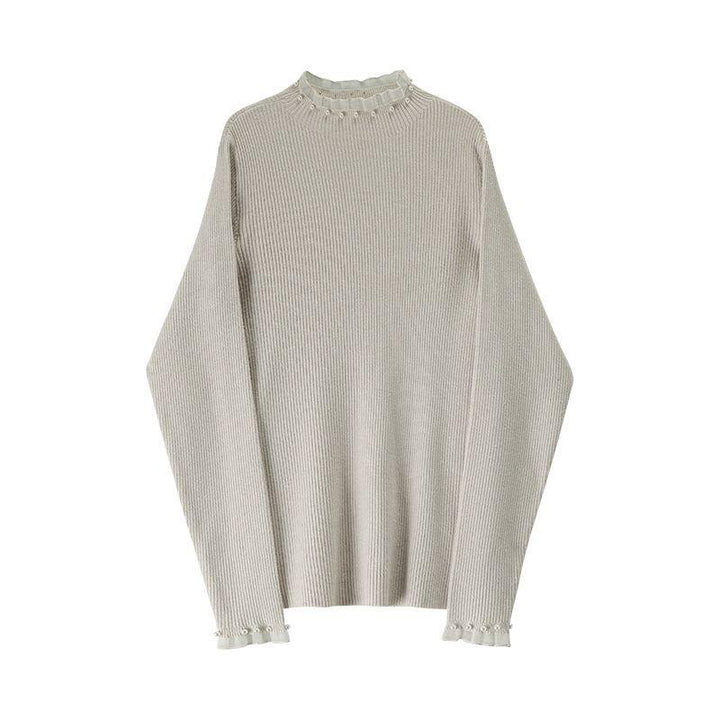 Women's knitted pullover with stand collar and pearl details