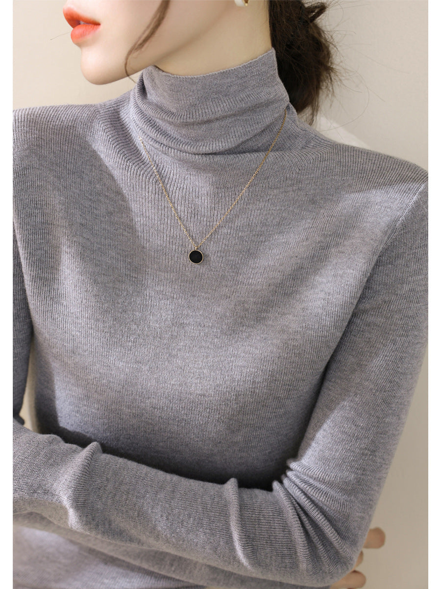 Women's knitted sweater, fitted, with stand-up collar