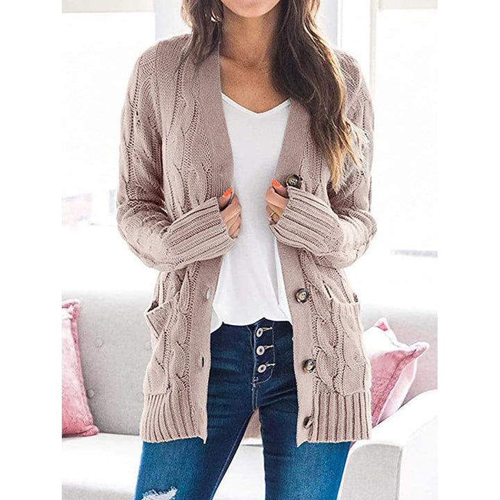 Chunky knit cardigan for women with an elaborate cable pattern and practical pockets Lune London