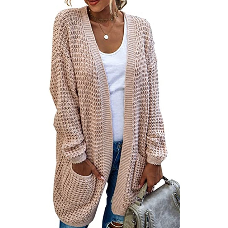 Ladies chunky knit cardigan with relaxed silhouette and open pockets Lune London