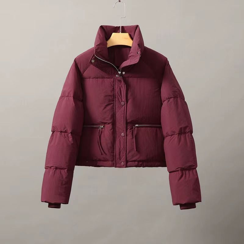 Short ladies' quilted jacket with stand-up collar