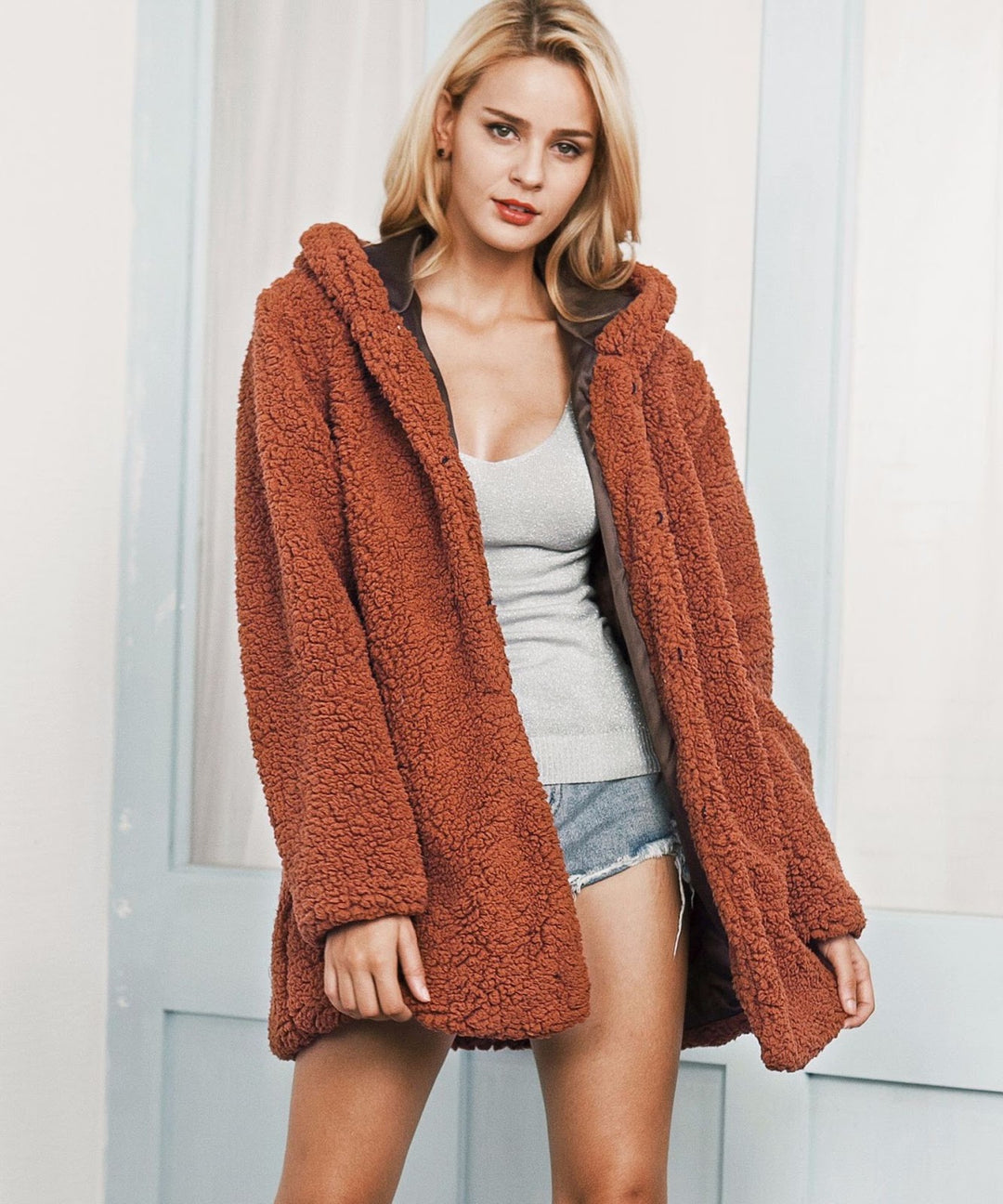 Long women's winter coat with hood in teddy look