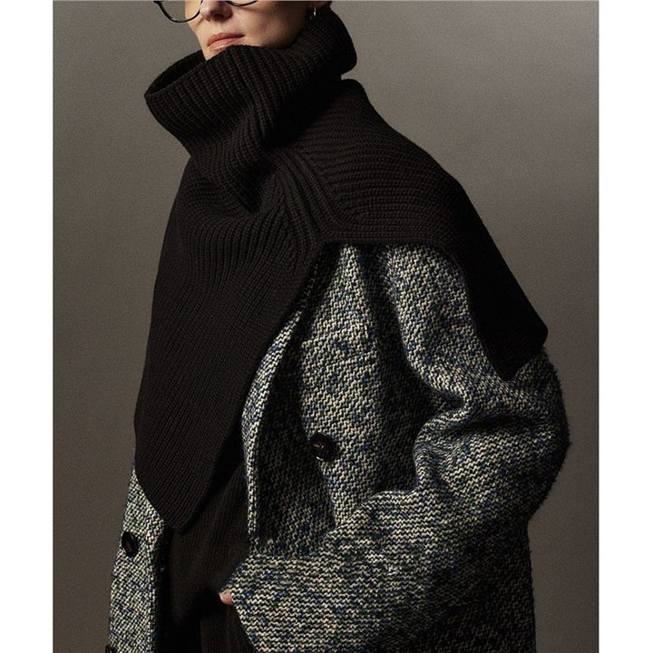 Knitted shoulder warmer made of merino wool with slit