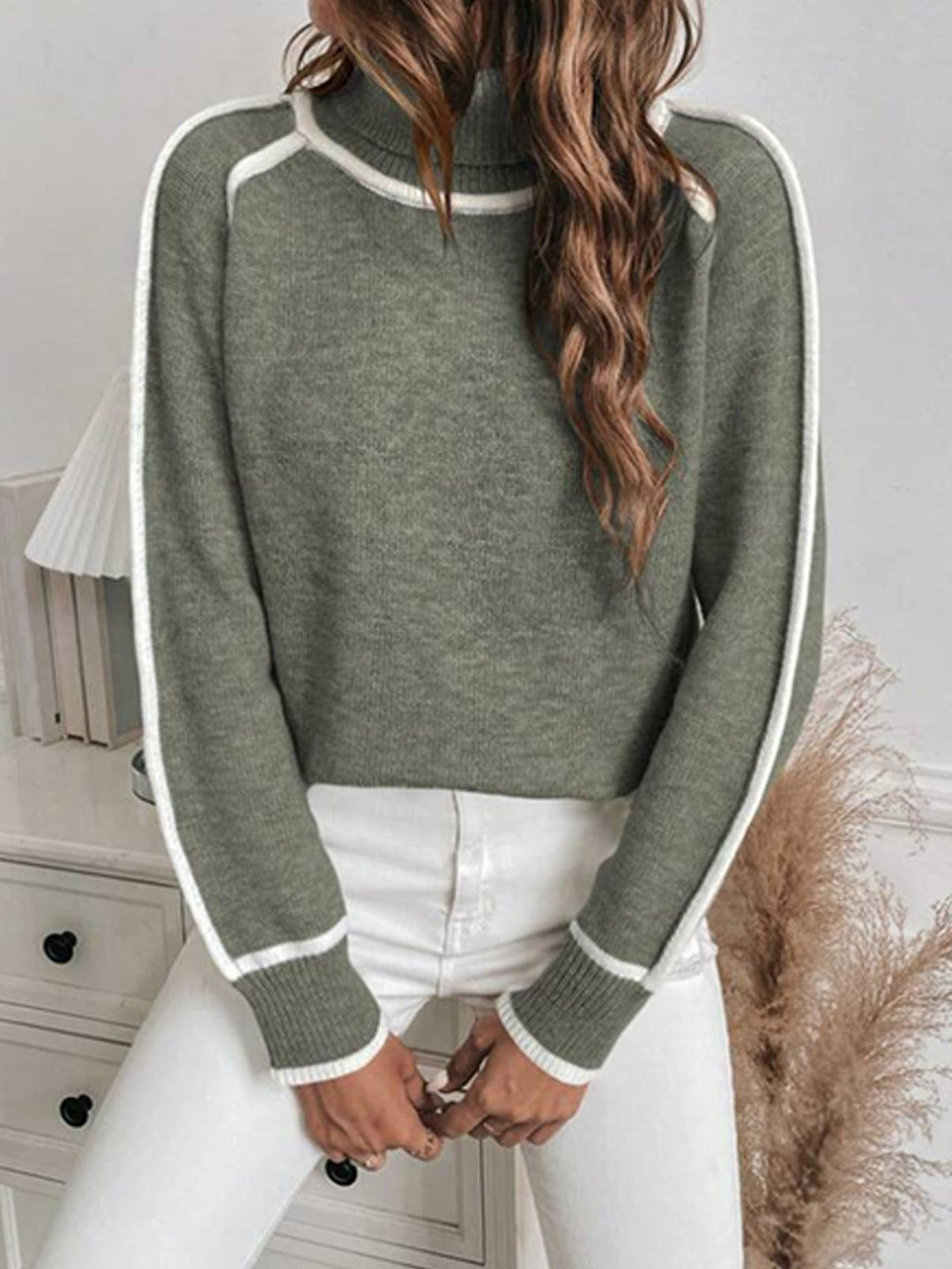 Loose women's knit sweater with high collar