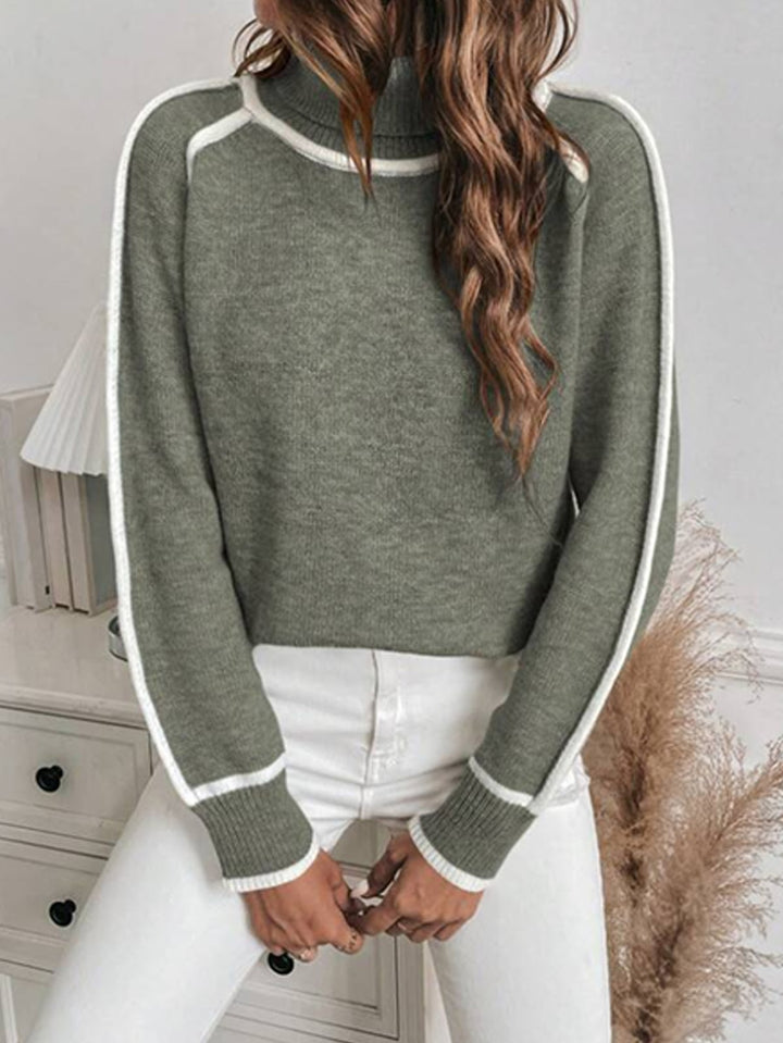 Loose women's knit sweater with high collar