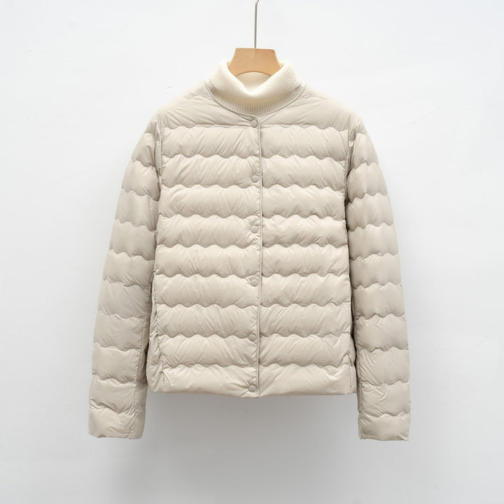 Light women’s down jacket with round neck and wave pattern