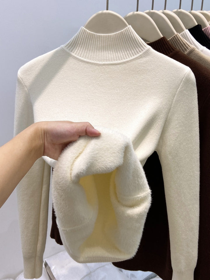 Padded women's knit sweater with high collar