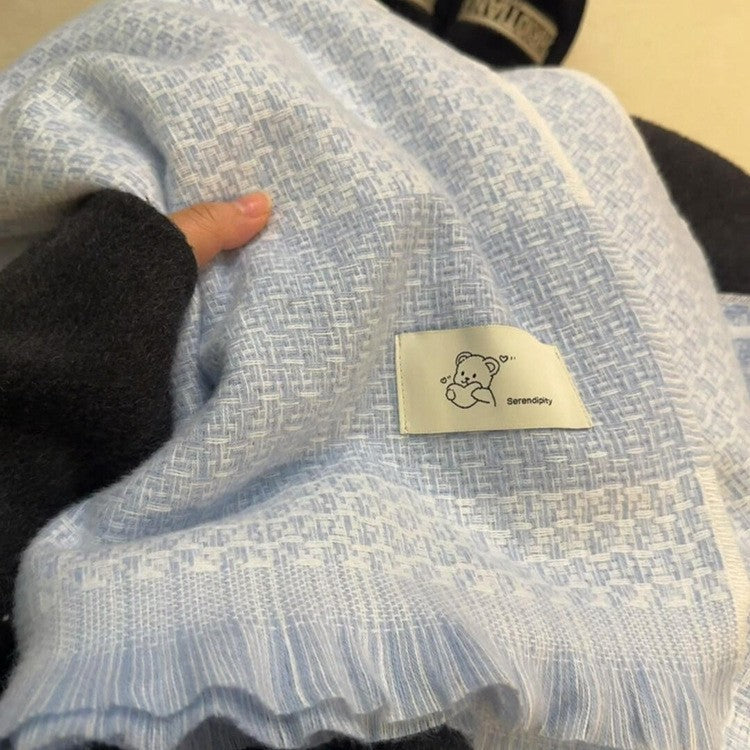 Knitted winter scarf with bear motif