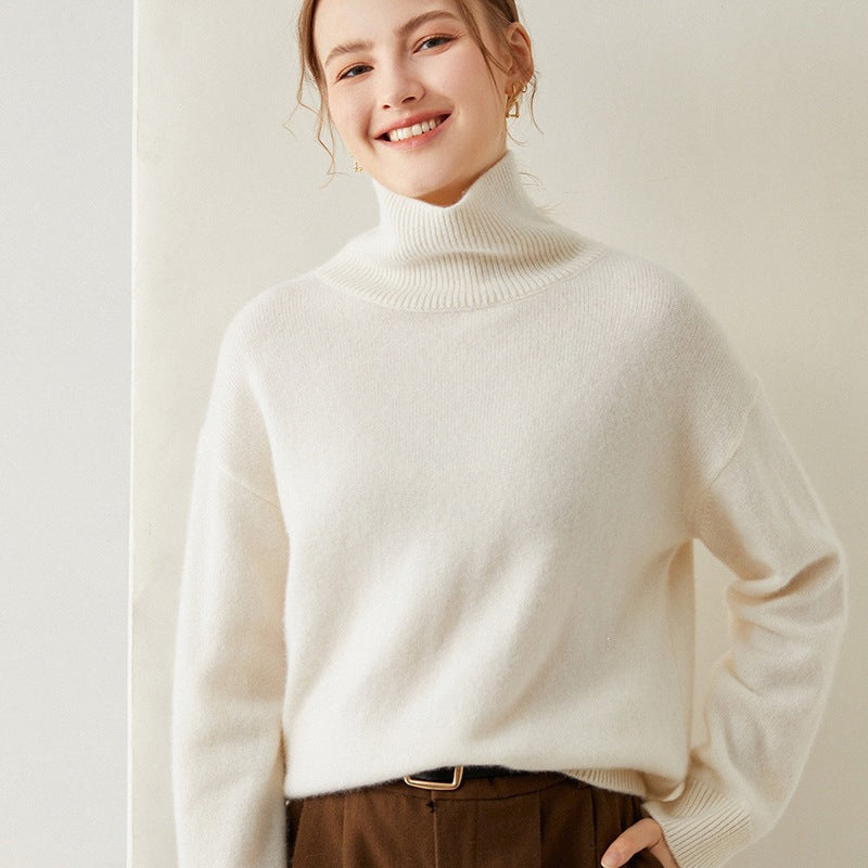 Loose women's knitted sweater with turtleneck