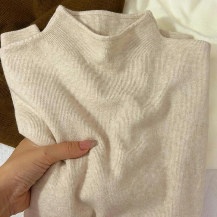 Slim women's knitted sweater with stand-up collar