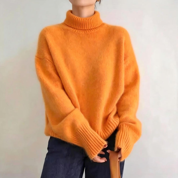 Loose women's knitted sweater with turtleneck