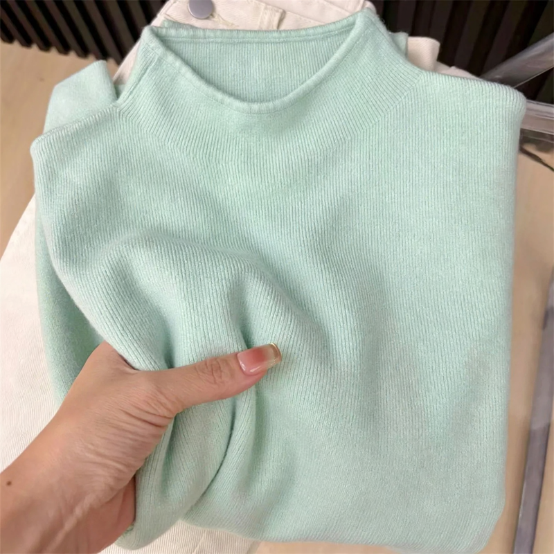 Slim women's knitted sweater with stand-up collar