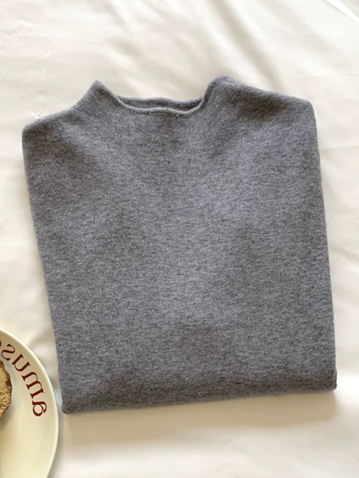 Slim women's knitted sweater with stand-up collar