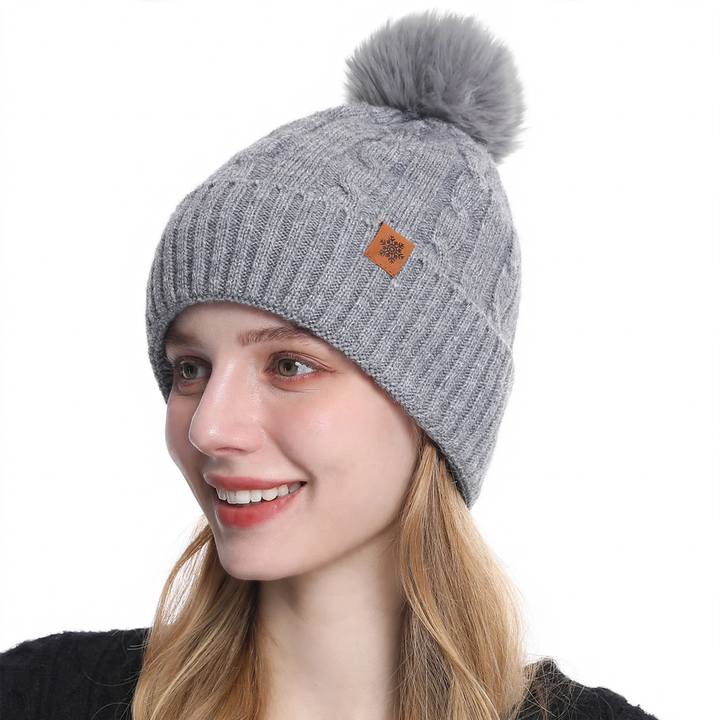 Winter set consisting of knitted hat, scarf, and gloves