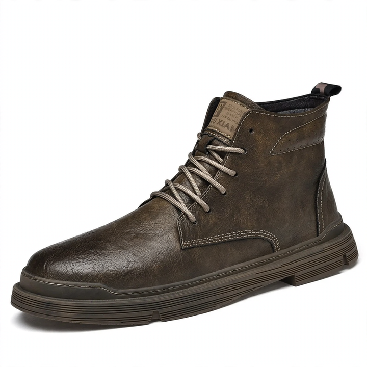 Padded men's leather boots with decorative stitching
