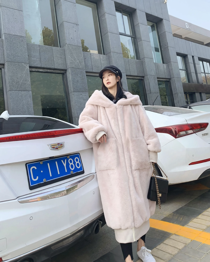 Long women's faux fur coat with hood