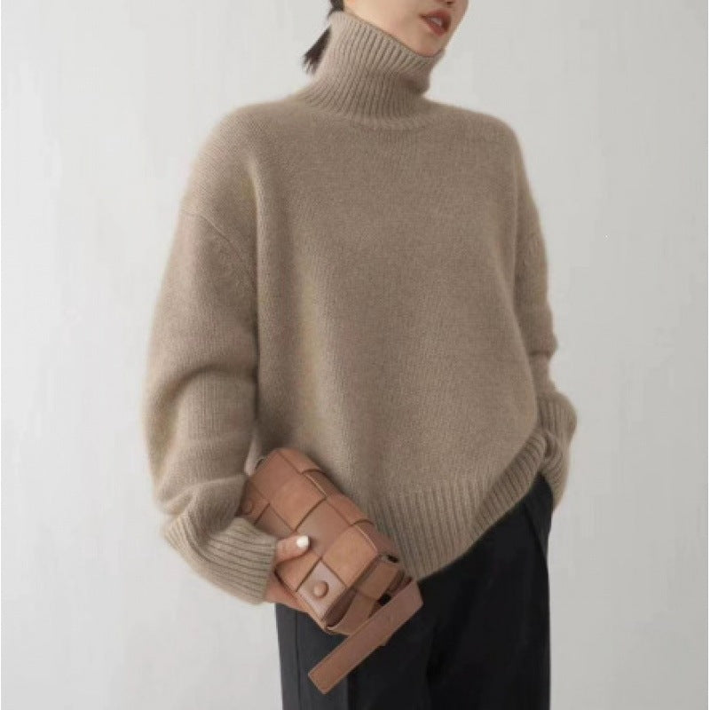 Loose women's knitted sweater with turtleneck