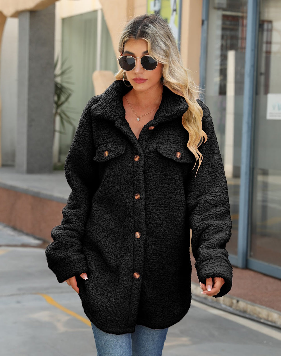 Long women's coat made of soft plush with notched collar