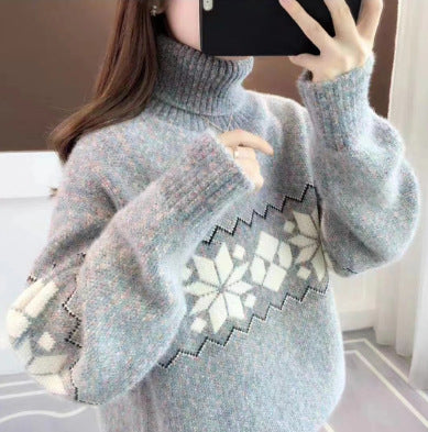 Women's knitted pullover with snowflake pattern and stand-up collar
