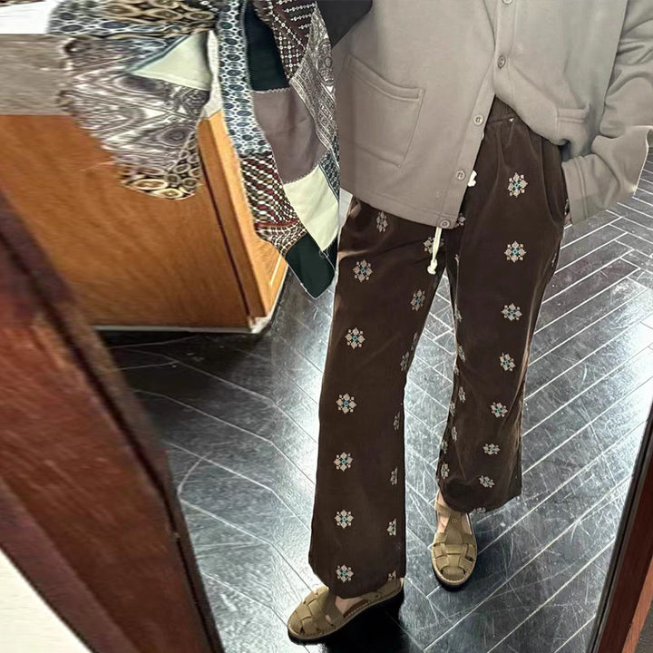 Cord pants with embroidery and flared leg