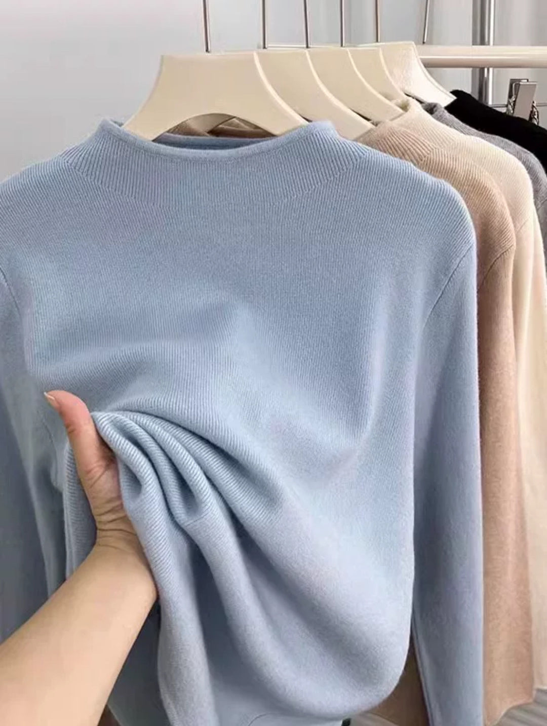 Women's knitted pullover with stand-up collar, ribbed