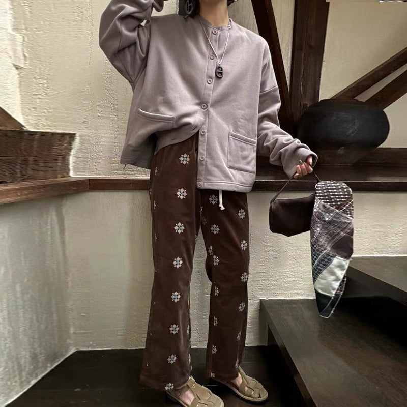 Cord pants with embroidery and flared leg