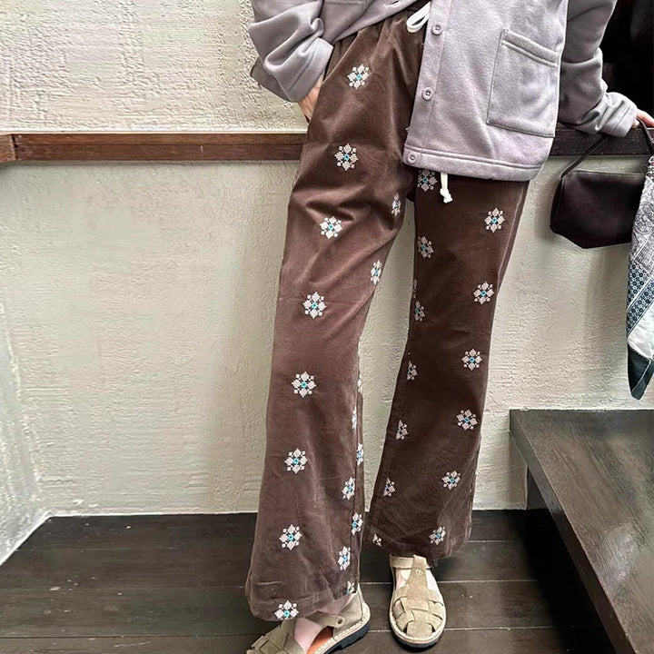 Cord pants with embroidery and flared leg