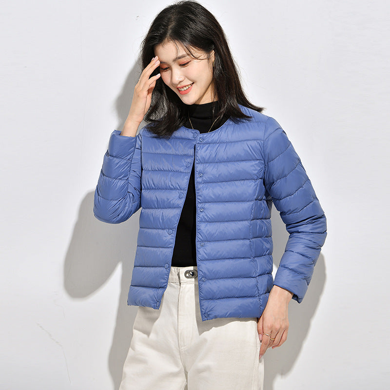 Light women's down jacket, short, as a base layer jacket