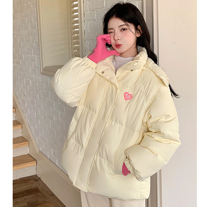 Short, padded women's winter jacket in puffer style